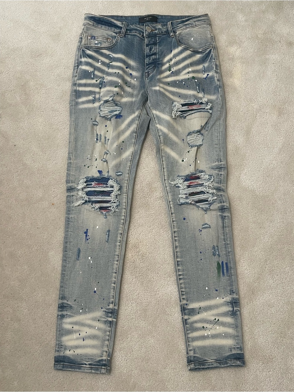 AMIRI Light Blue Distressed Skinny Jeans with Paint Splatter